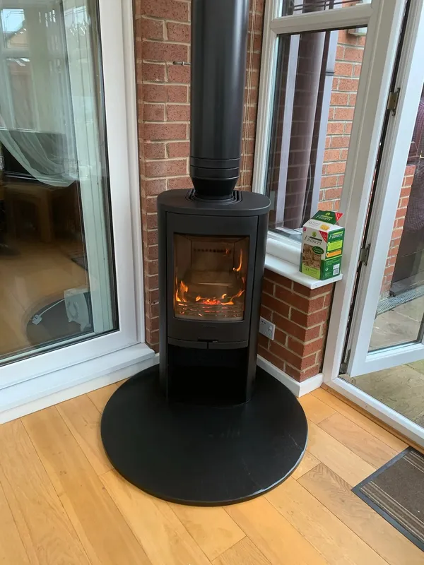 Contura 810 freestanding stove in conservatory
