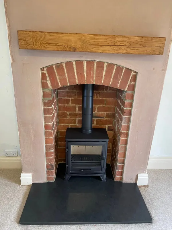 Capital Bassington stove in traditional brick chimney