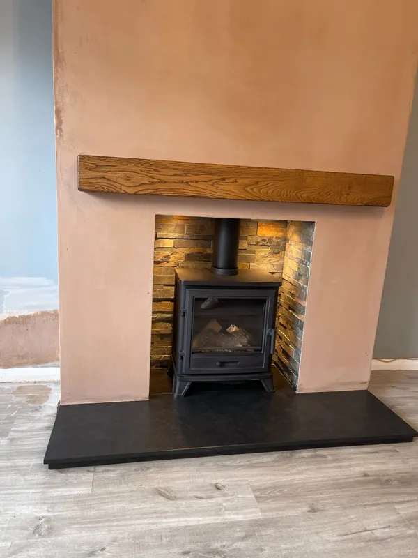Capital Bassington stove in modern tiled chamber